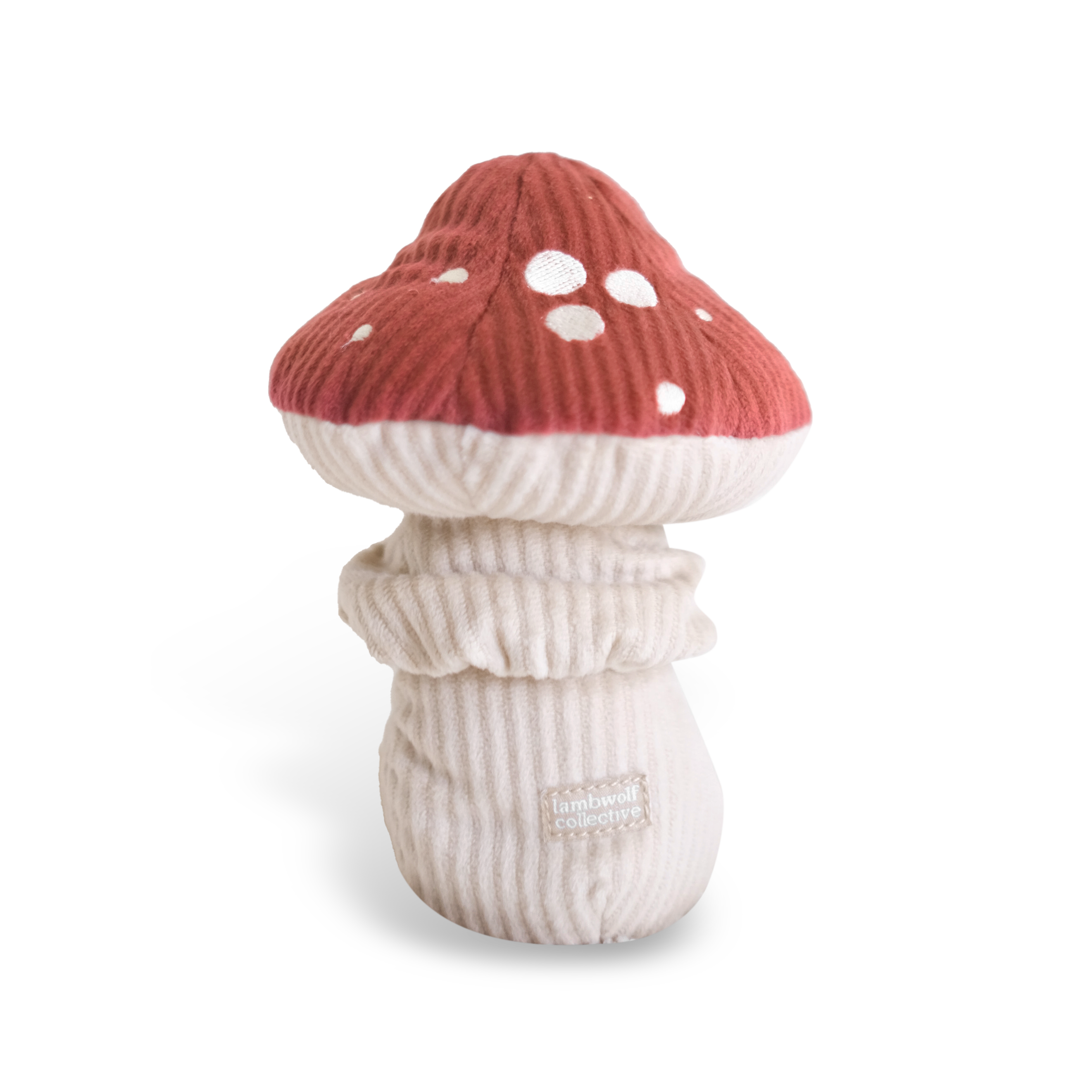 SHROOM Schnüffelspielzeug von Lambwolf – roter Stoffpilz mit weißen Punkten auf weißem Hintergrund